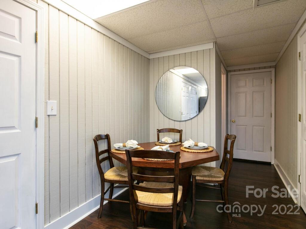 15 Devonshire Drive Candler, NC 28715 - Photo 33 of 43 a dining room with furniture and a mirror