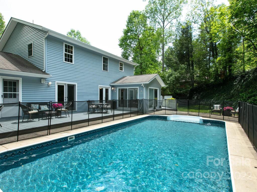15 Devonshire Drive Candler, NC 28715 - Photo 4 of 43 a view of a house with backyard and sitting area