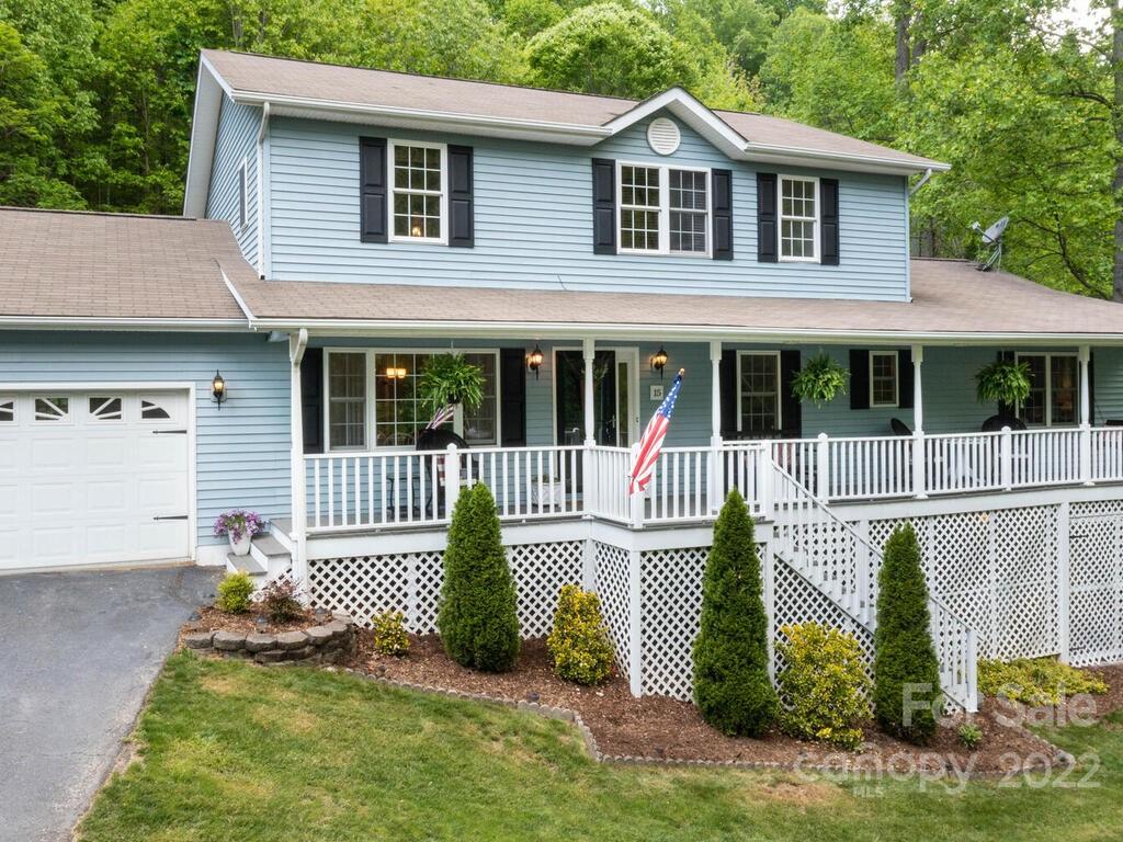 15 Devonshire Drive Candler, NC 28715 - Photo 41 of 43 a front view of a house with a garden