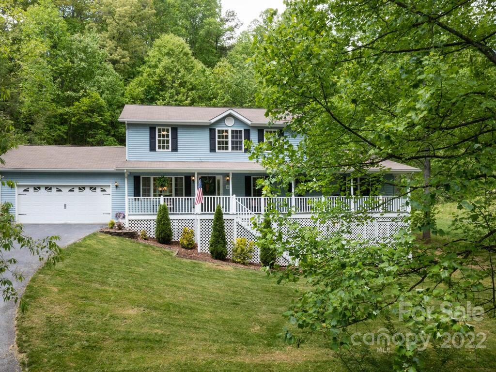 15 Devonshire Drive Candler, NC 28715 - Photo 42 of 43 a front view of a house with a yard table and chairs