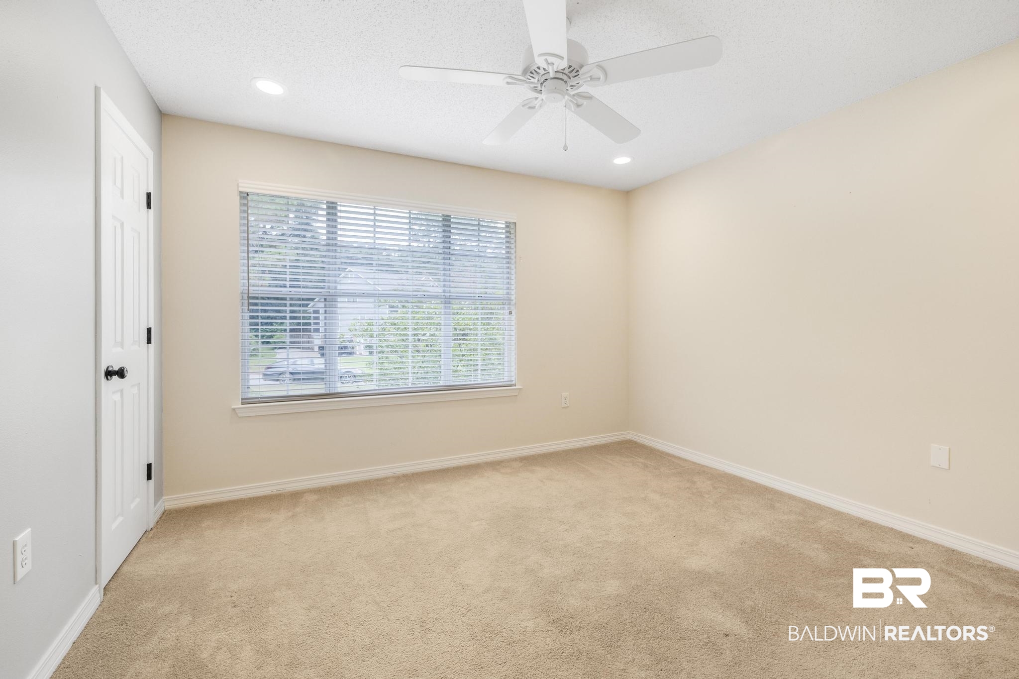 140 Hope Drive Daphne, AL 36526 - Photo 32 of 54 Empty room with light colored carpet, a textured ceiling, recessed lighting, and a ceiling fan