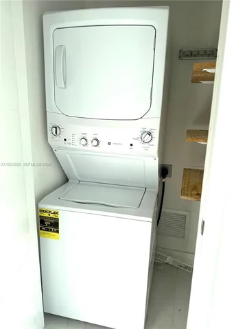 a living room with couches rug and outdoor view