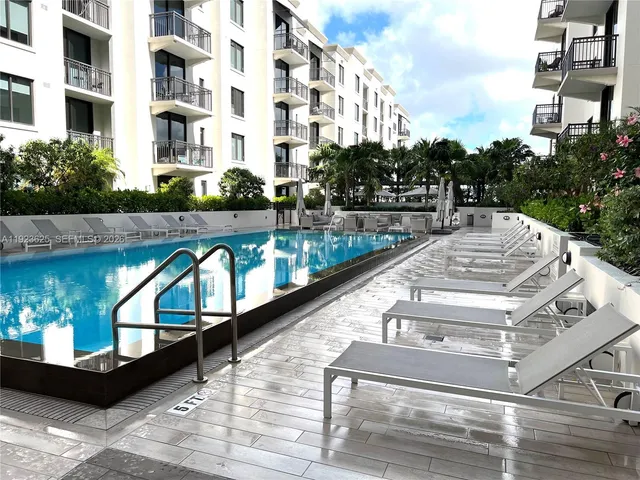 a view of a patio with couches and table and chairs