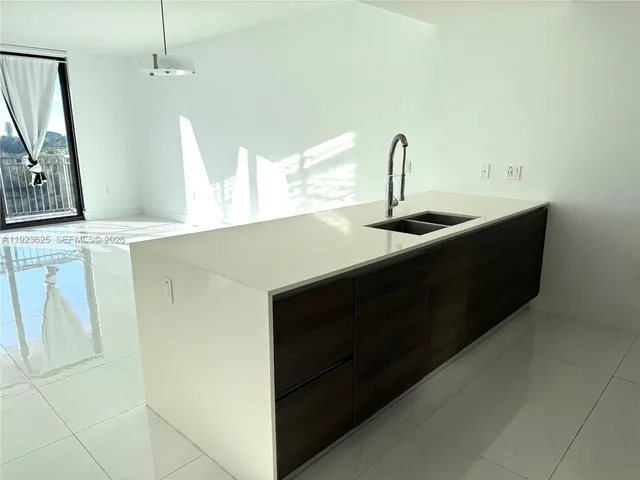 a bathroom with a sink a mirror and a bathtub