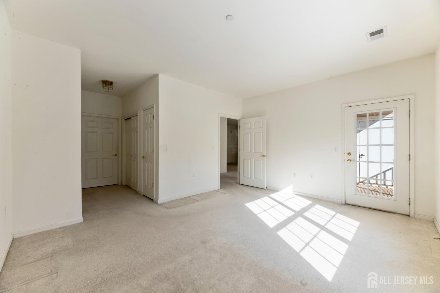 540 Cranbury Road, Unit 104 East Brunswick, NJ 08816 - Photo 14 of 43 a view of livingroom with window