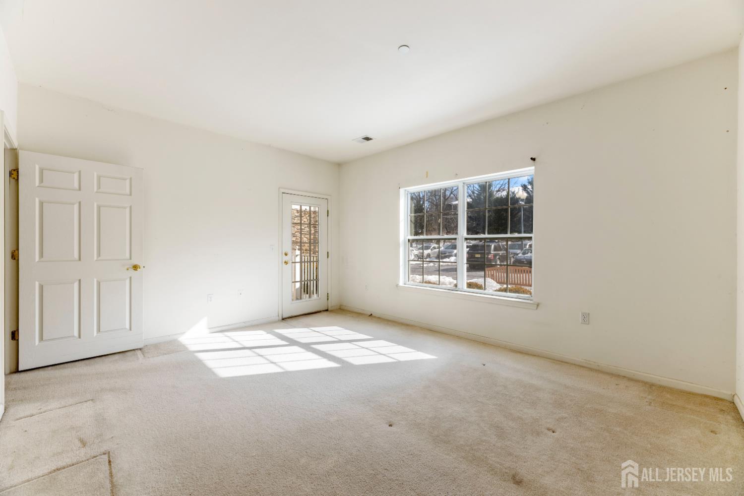 540 Cranbury Road, Unit 104 East Brunswick, NJ 08816 - Photo 15 of 43 a view of an empty room with a window