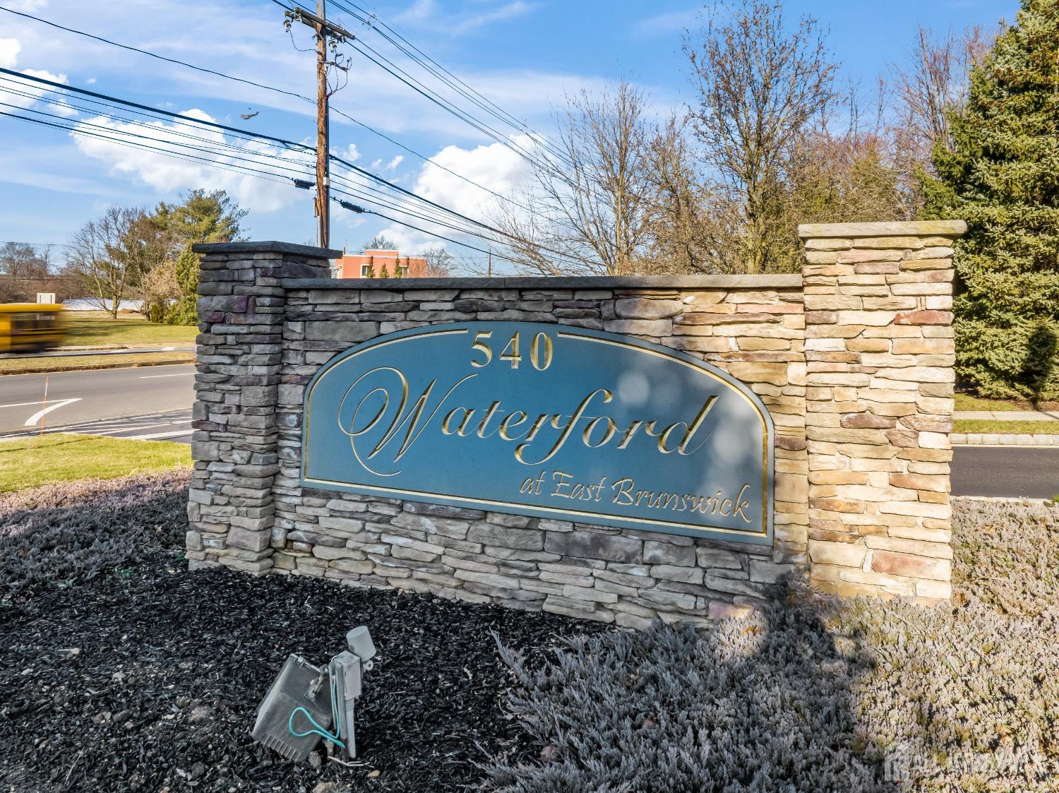 540 Cranbury Road, Unit 104 East Brunswick, NJ 08816 - Photo 42 of 43 a sign on the side of a building