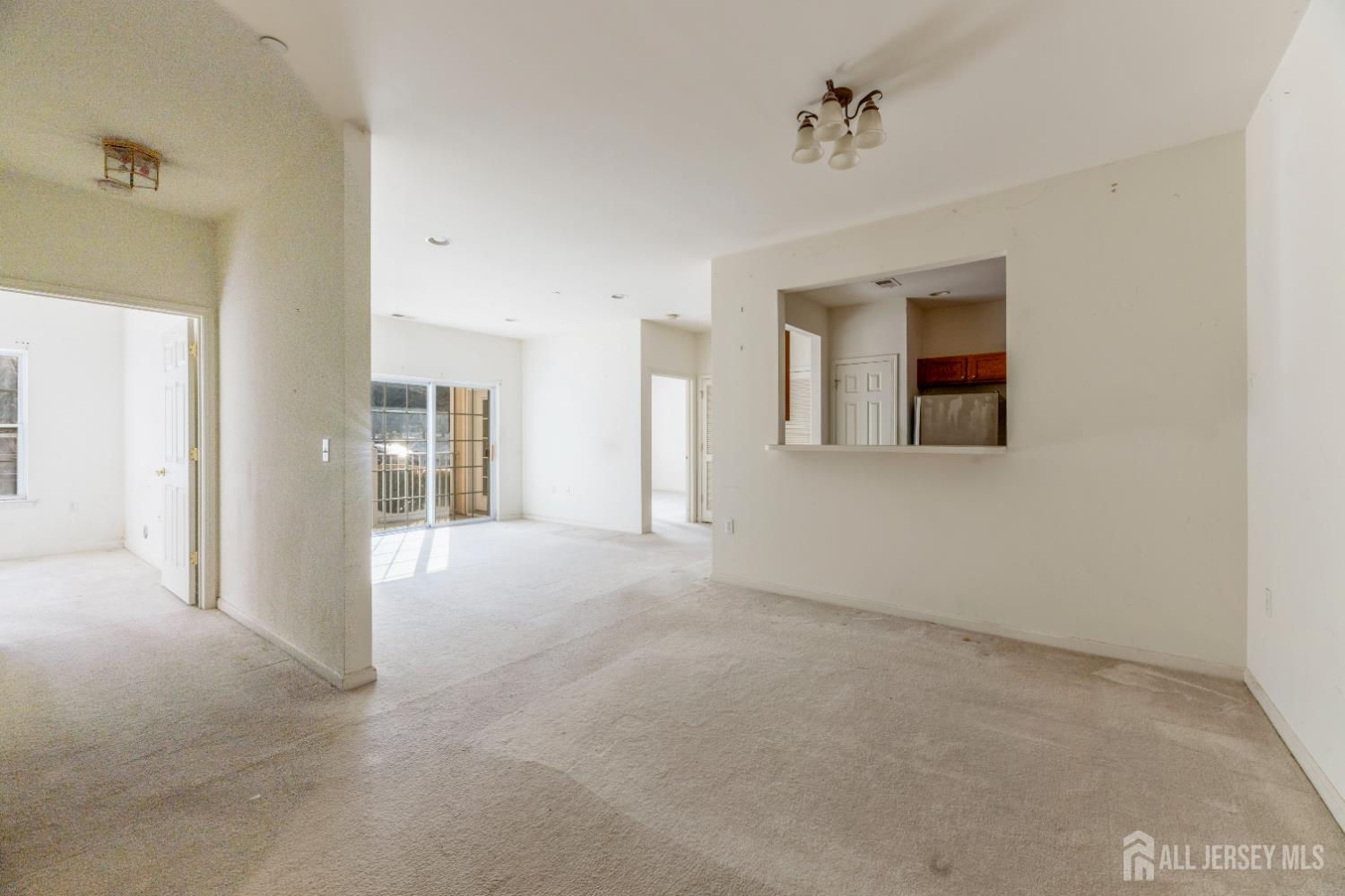 540 Cranbury Road, Unit 104 East Brunswick, NJ 08816 - Photo 6 of 43 a view of a big room with closet and windows