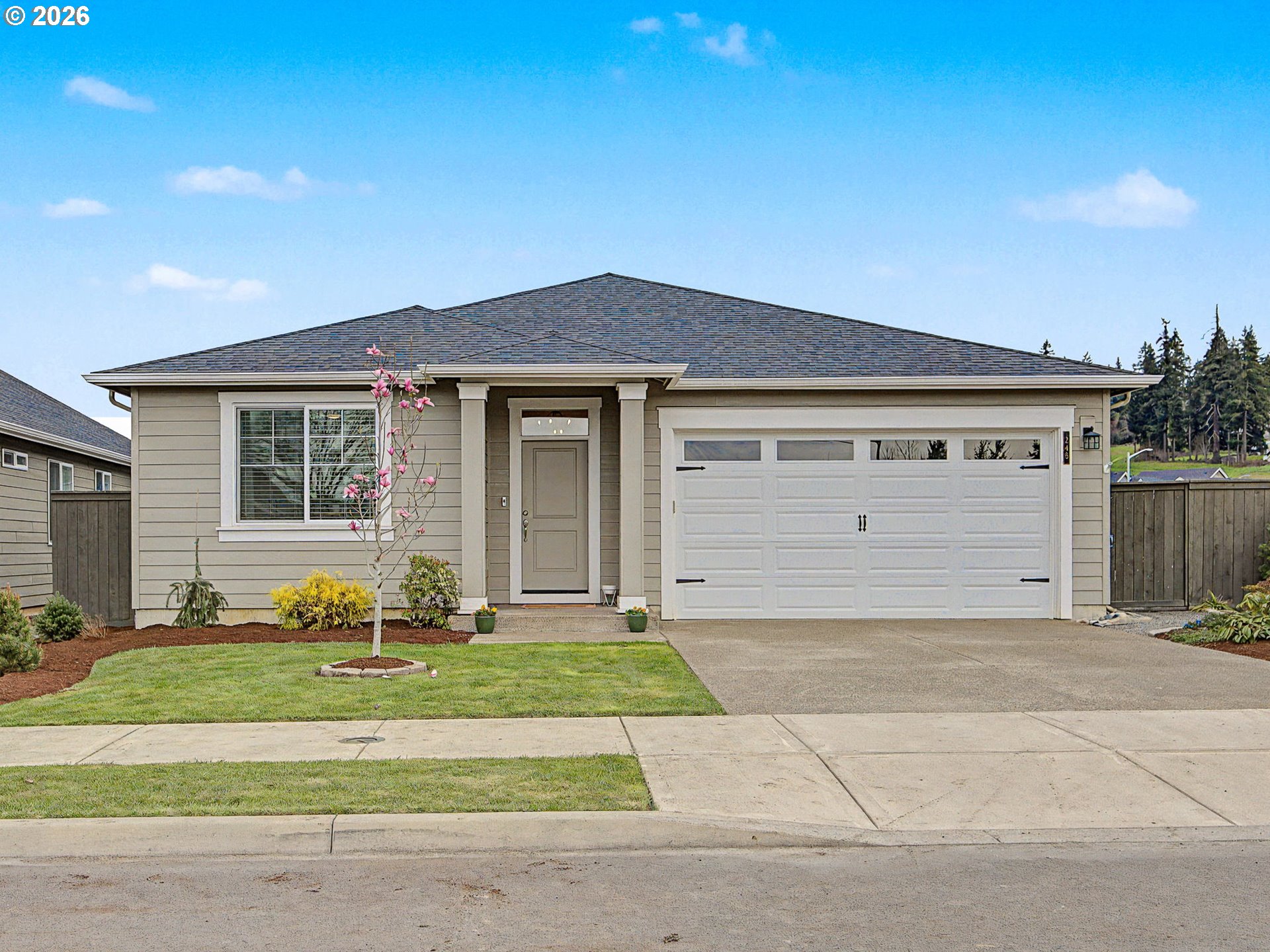 245 Northeast Hill Way Estacada, OR 97023 - Photo 1 of 45 a front view of a house with a yard and outdoor seating