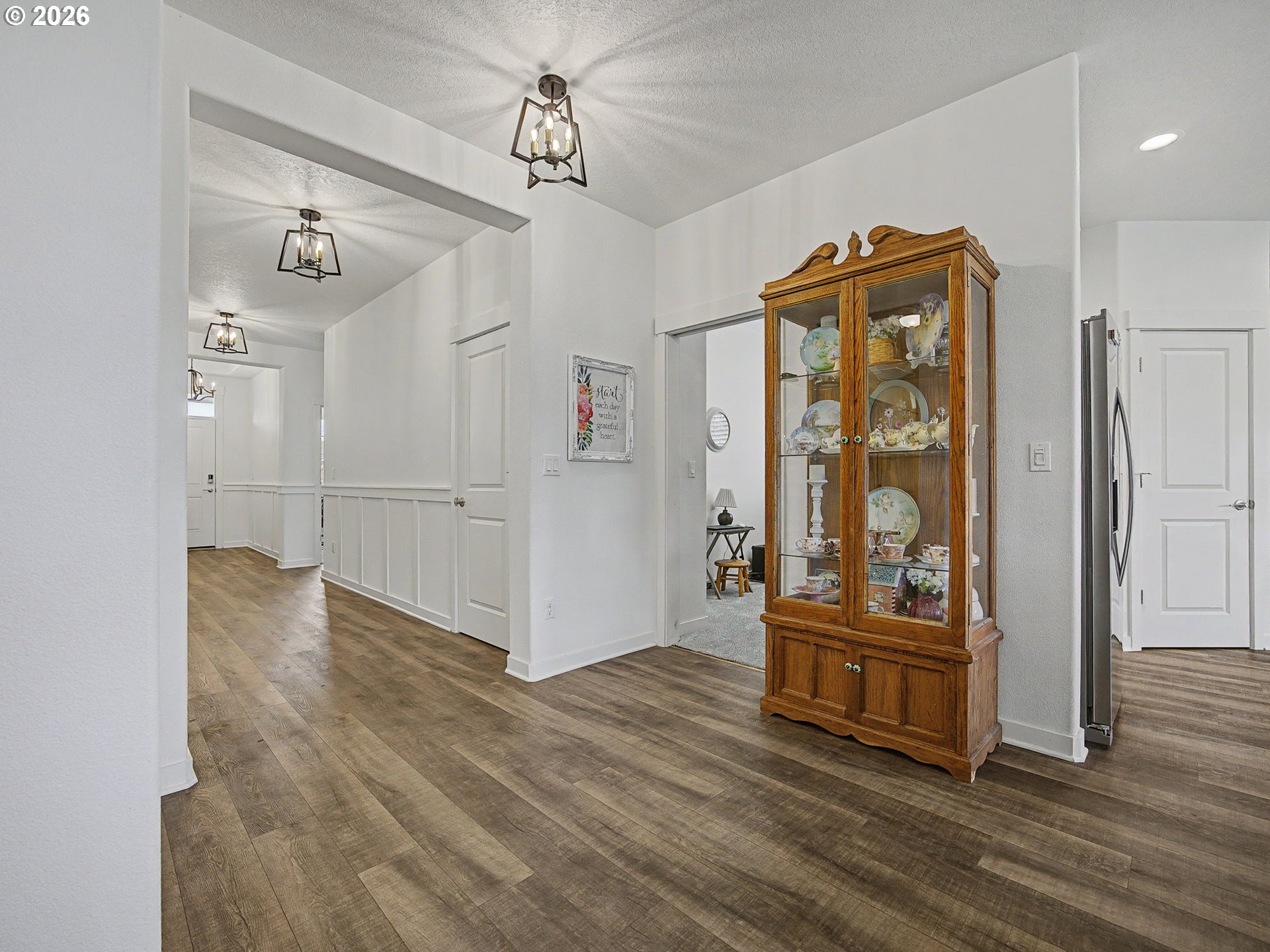 245 Northeast Hill Way Estacada, OR 97023 - Photo 11 of 45 a view of a livingroom with wooden floor and stairs