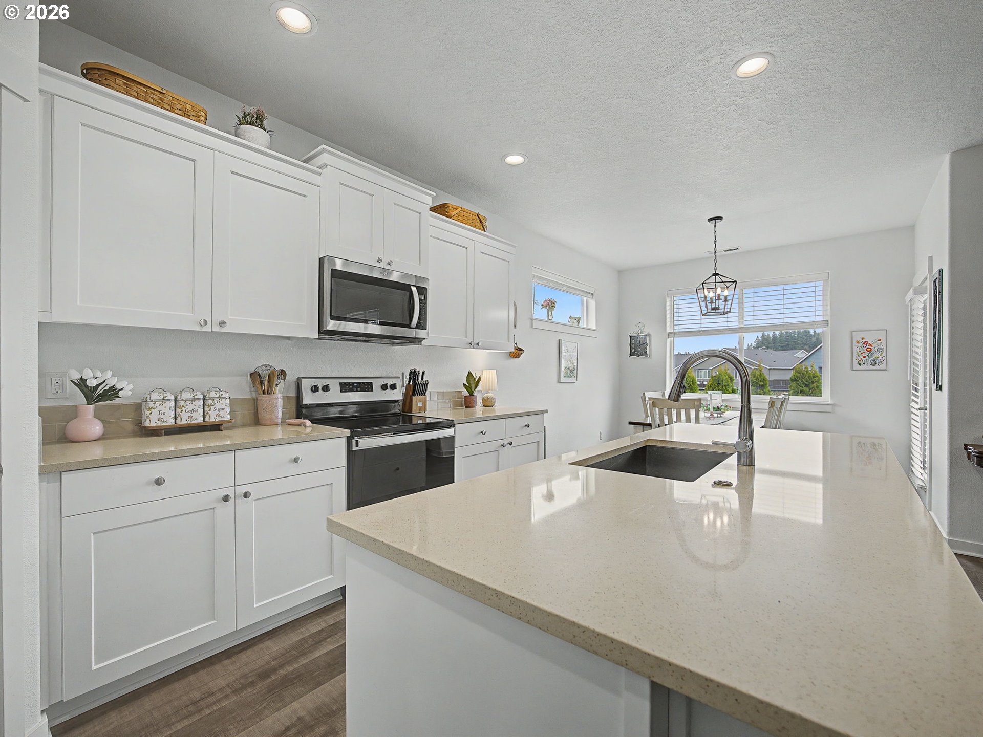 245 Northeast Hill Way Estacada, OR 97023 - Photo 12 of 45 a kitchen with a sink a stove and cabinets