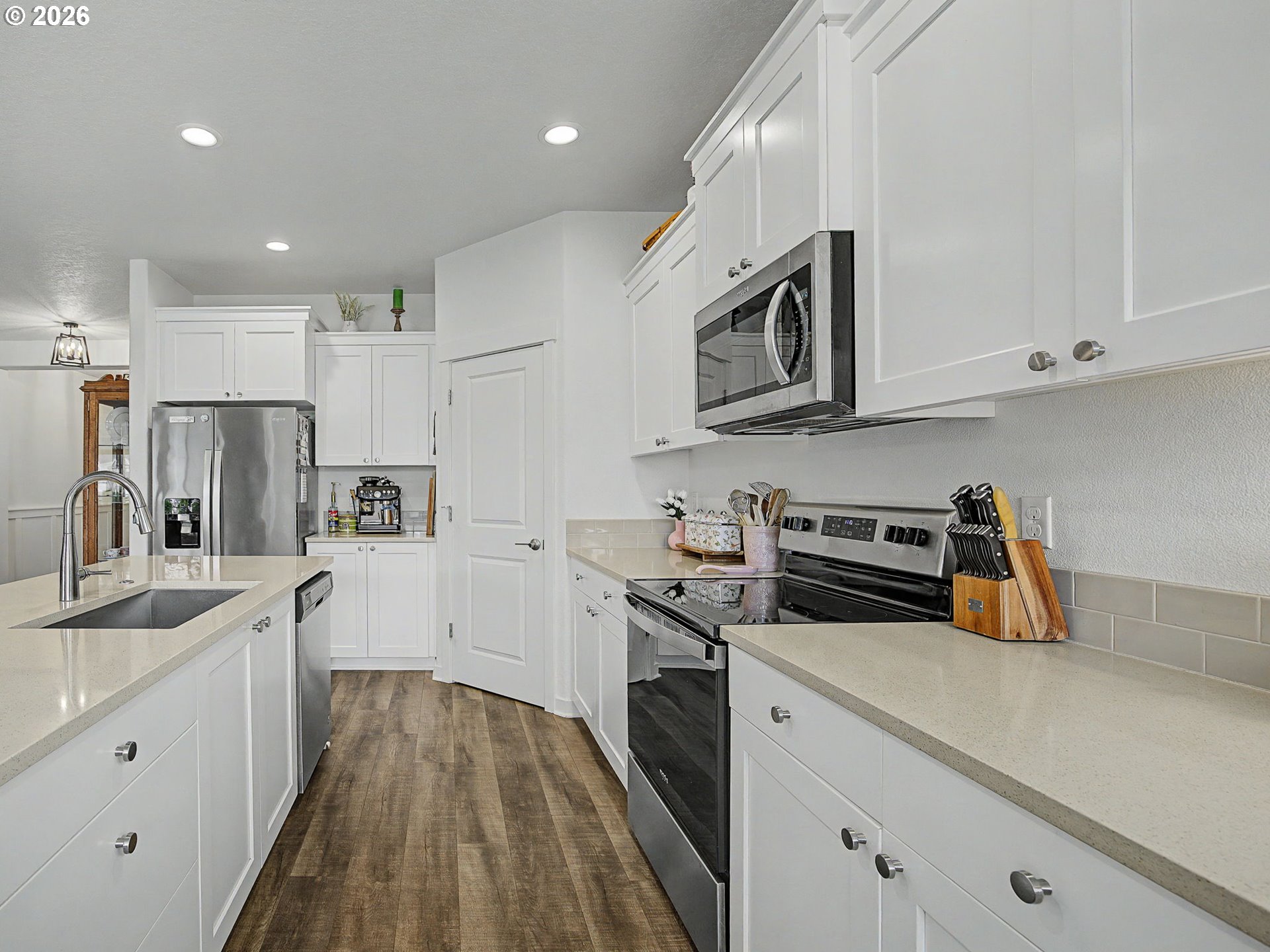 245 Northeast Hill Way Estacada, OR 97023 - Photo 13 of 45 a kitchen with stainless steel appliances granite countertop a sink stove and refrigerator