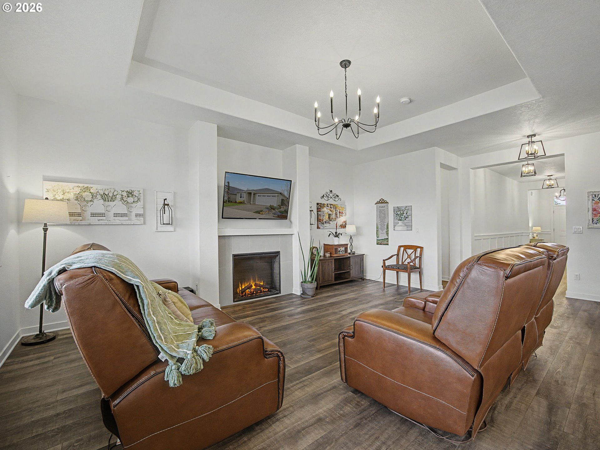 245 Northeast Hill Way Estacada, OR 97023 - Photo 19 of 45 a living room with furniture a fireplace and a chandelier