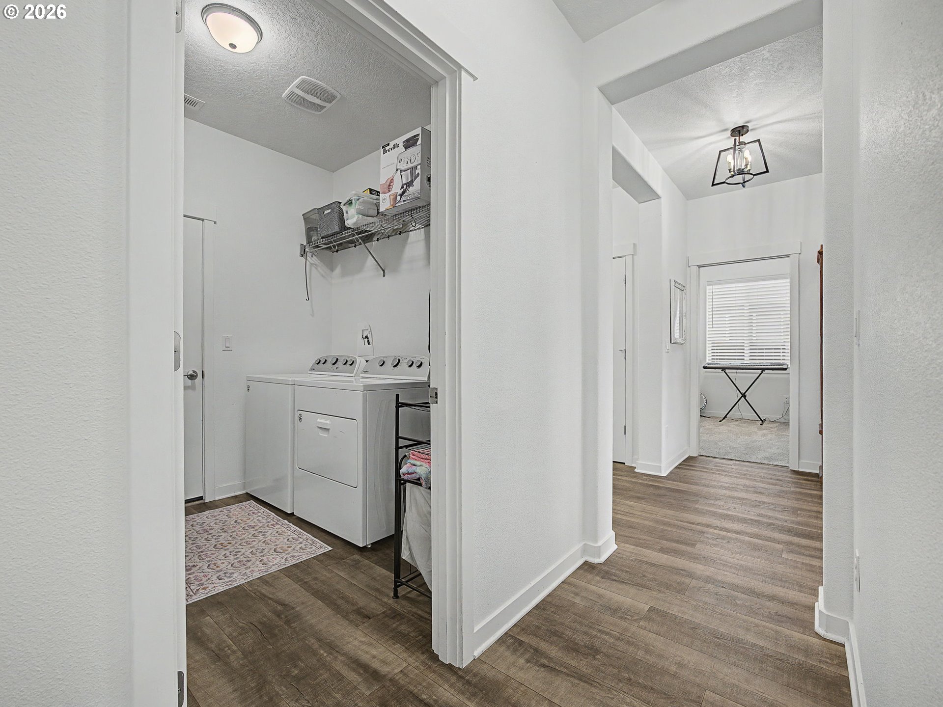 245 Northeast Hill Way Estacada, OR 97023 - Photo 24 of 45 a hallway with wooden floor windows and livingroom