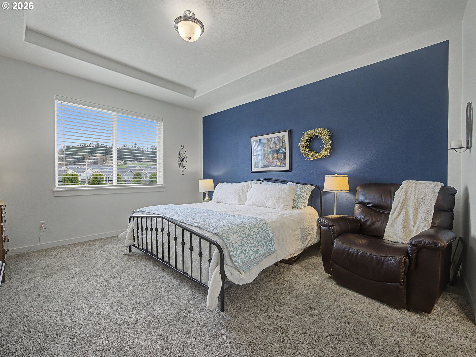 245 Northeast Hill Way Estacada, OR 97023 - Photo 26 of 45 a bedroom with a bed couch and window