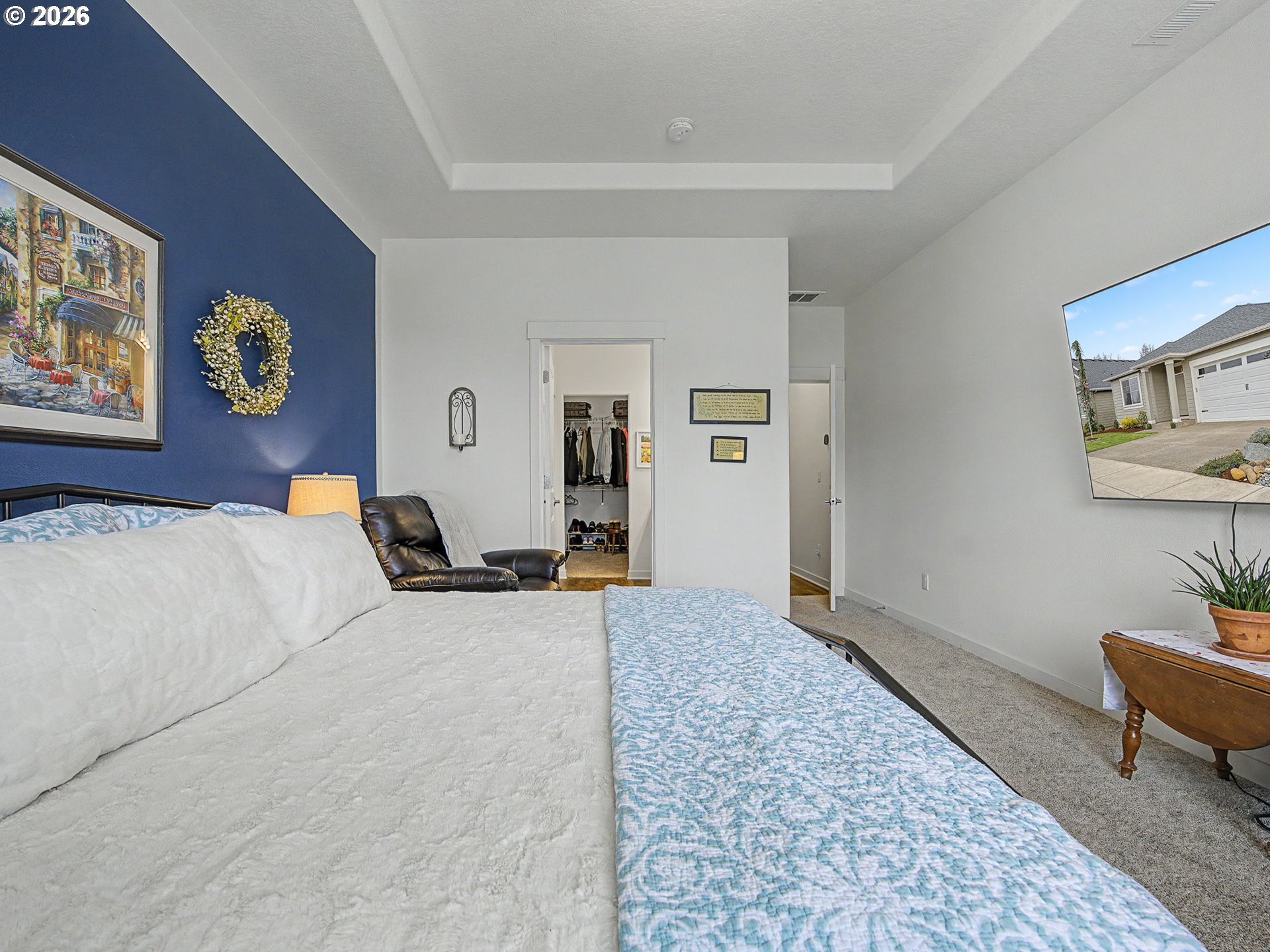 245 Northeast Hill Way Estacada, OR 97023 - Photo 27 of 45 a bedroom with a bed and wooden floor