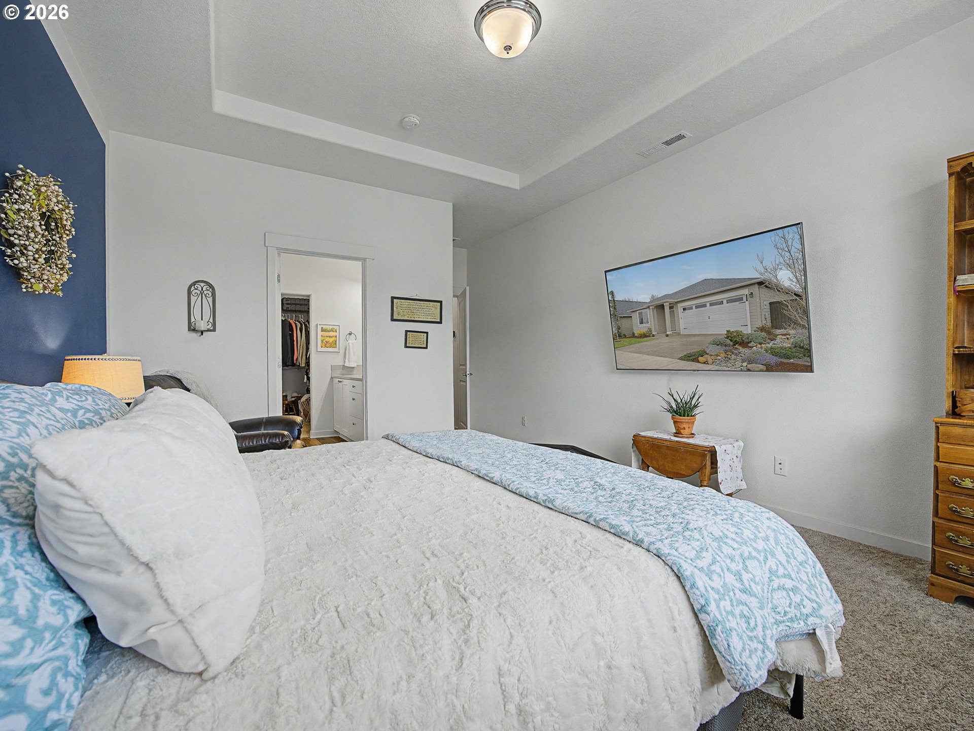 245 Northeast Hill Way Estacada, OR 97023 - Photo 28 of 45 a bedroom with a bed and a lamp on dresser