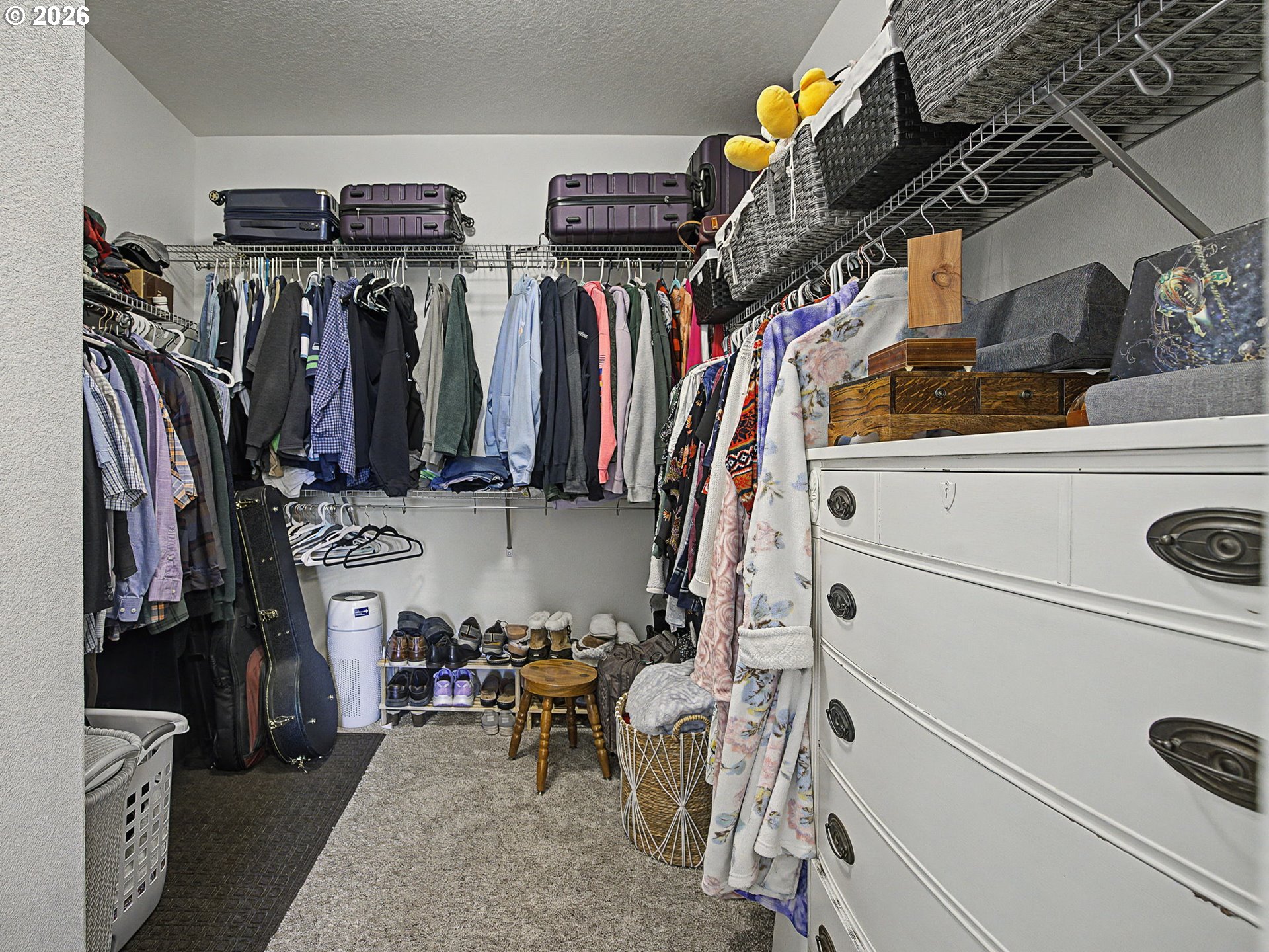 245 Northeast Hill Way Estacada, OR 97023 - Photo 34 of 45 a view of walk in closet with clothes and shoes