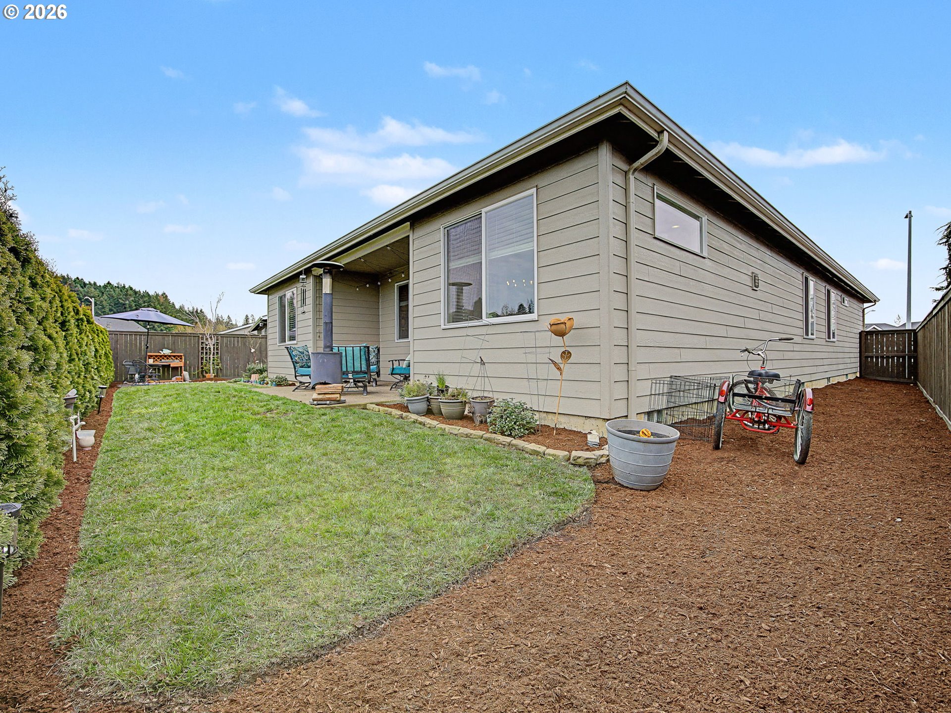 245 Northeast Hill Way Estacada, OR 97023 - Photo 40 of 45 a backyard of a house with table and chairs