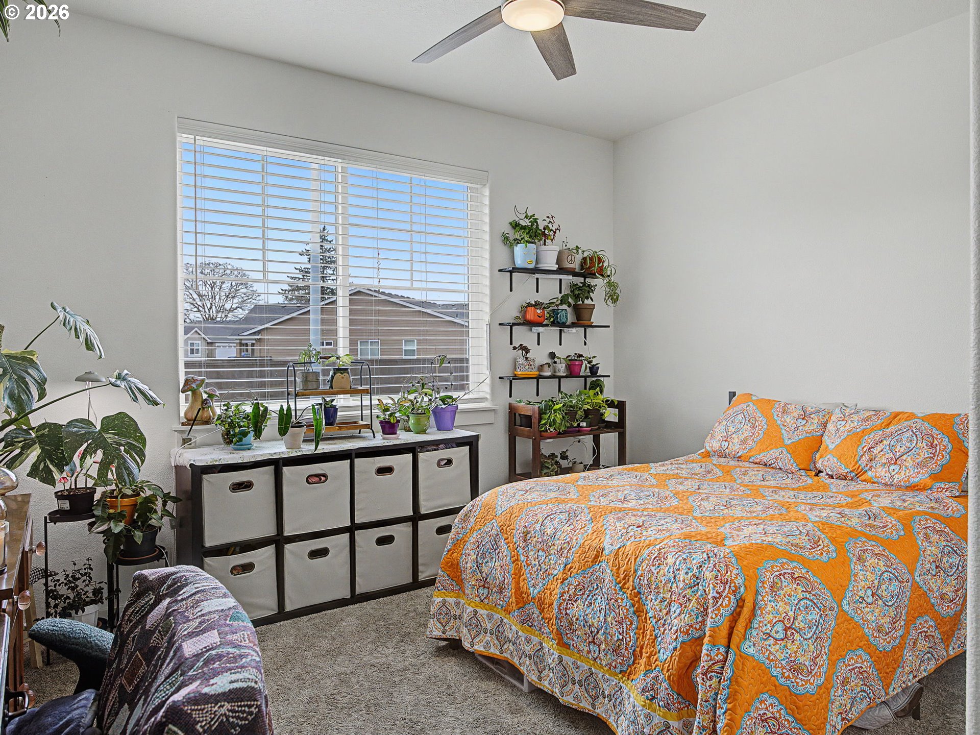 245 Northeast Hill Way Estacada, OR 97023 - Photo 5 of 45 a bed sitting in a bedroom next to a window