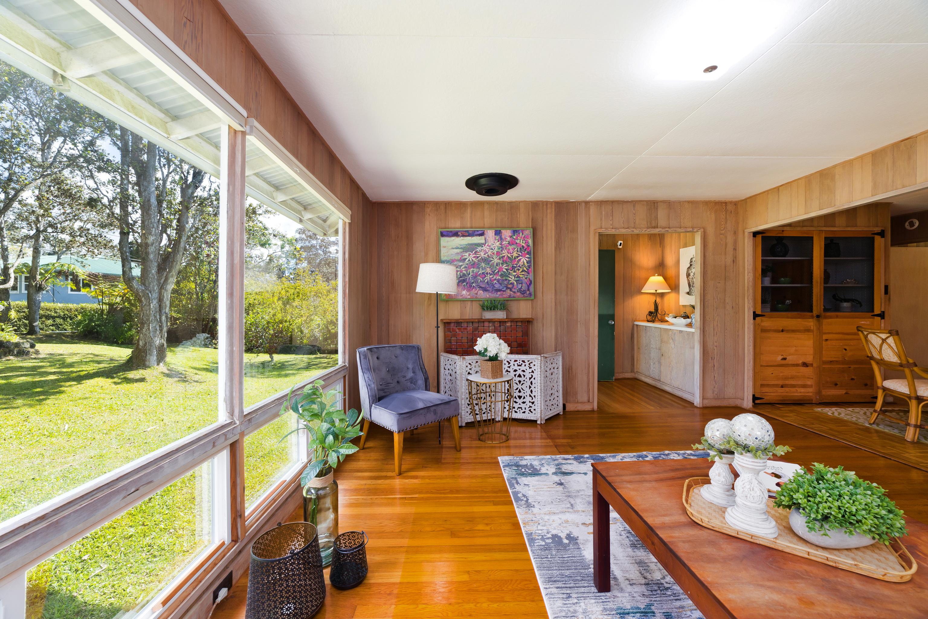 19-4113 Haunani Road Volcano, HI 96785 - Photo 11 of 30 a living room with furniture and a floor to ceiling window