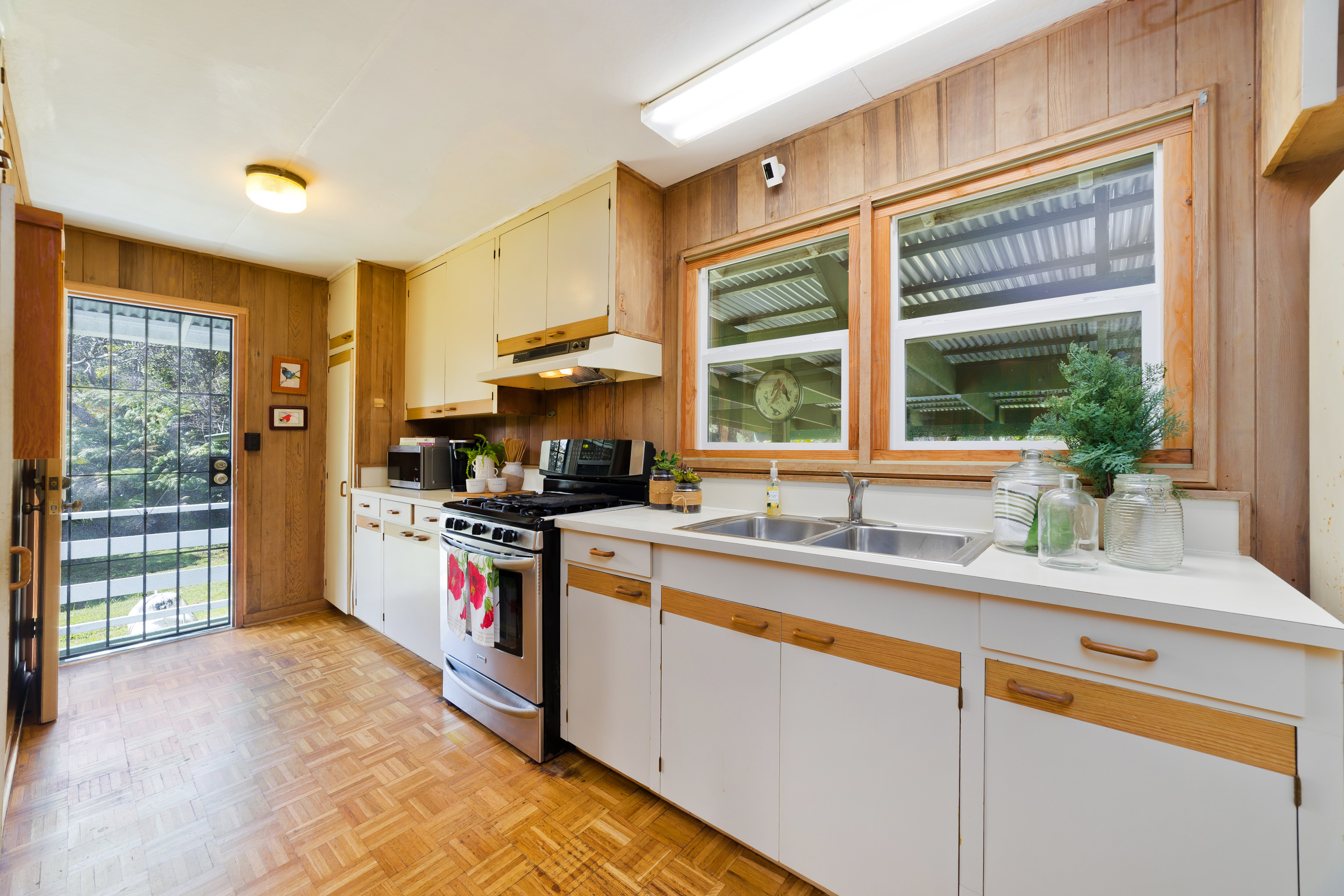 19-4113 Haunani Road Volcano, HI 96785 - Photo 14 of 30 a kitchen with granite countertop a sink and a stove
