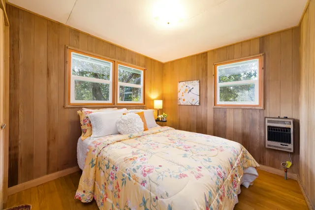 a bed room with a bed and a couch