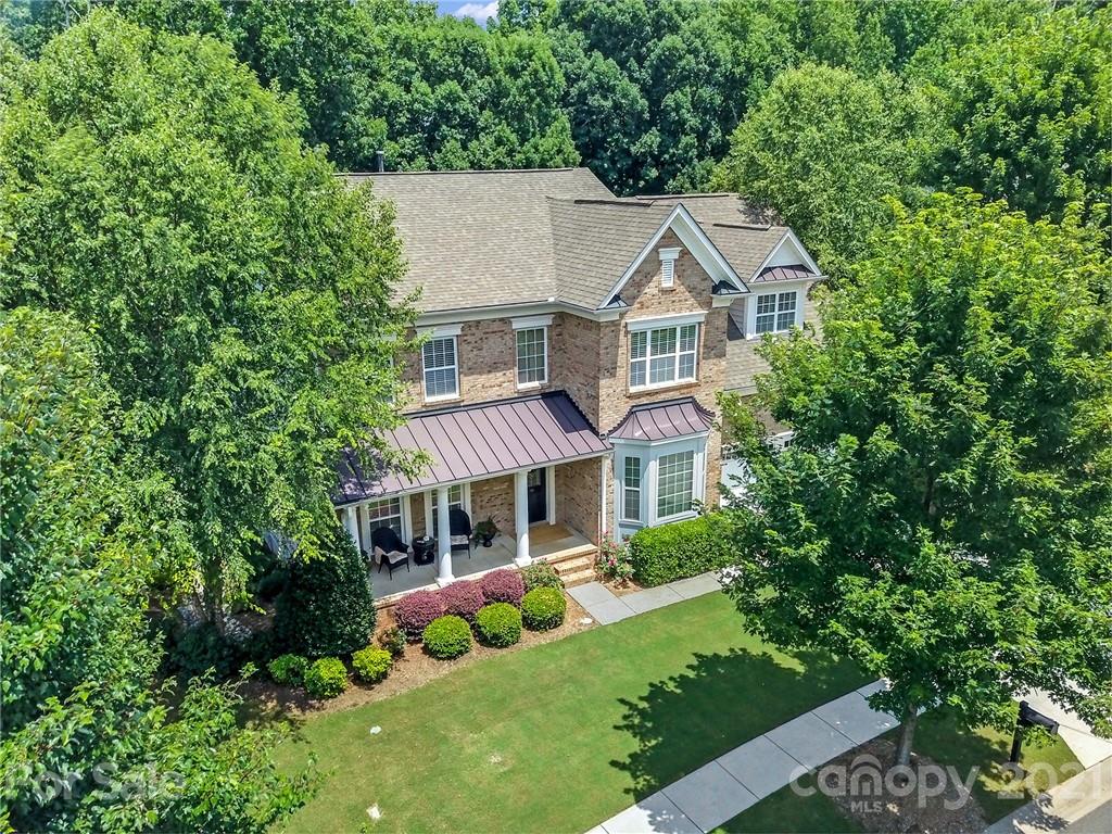392 Windell Drive Fort Mill, SC 29708 - Photo 1 of 40 a aerial view of a house with a yard and potted plants