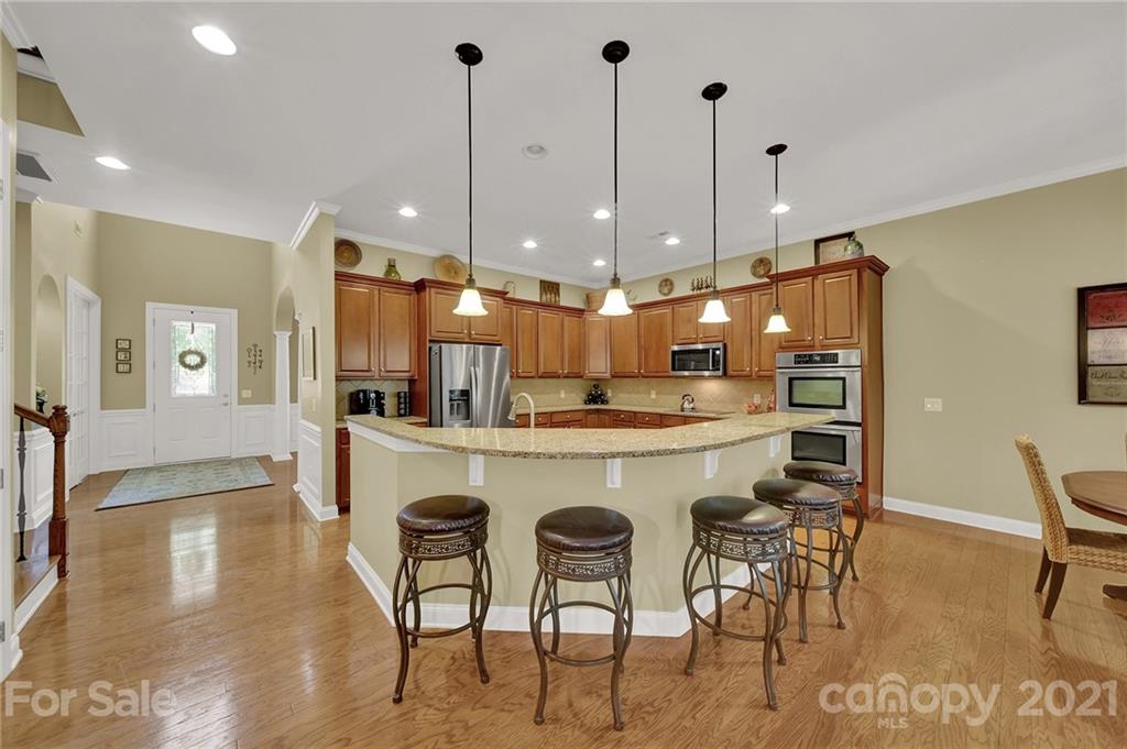 392 Windell Drive Fort Mill, SC 29708 - Photo 14 of 40 a large kitchen with a table and chairs