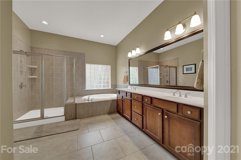 392 Windell Drive Fort Mill, SC 29708 - Photo 21 of 40 a bathroom with double vanity and a bathtub