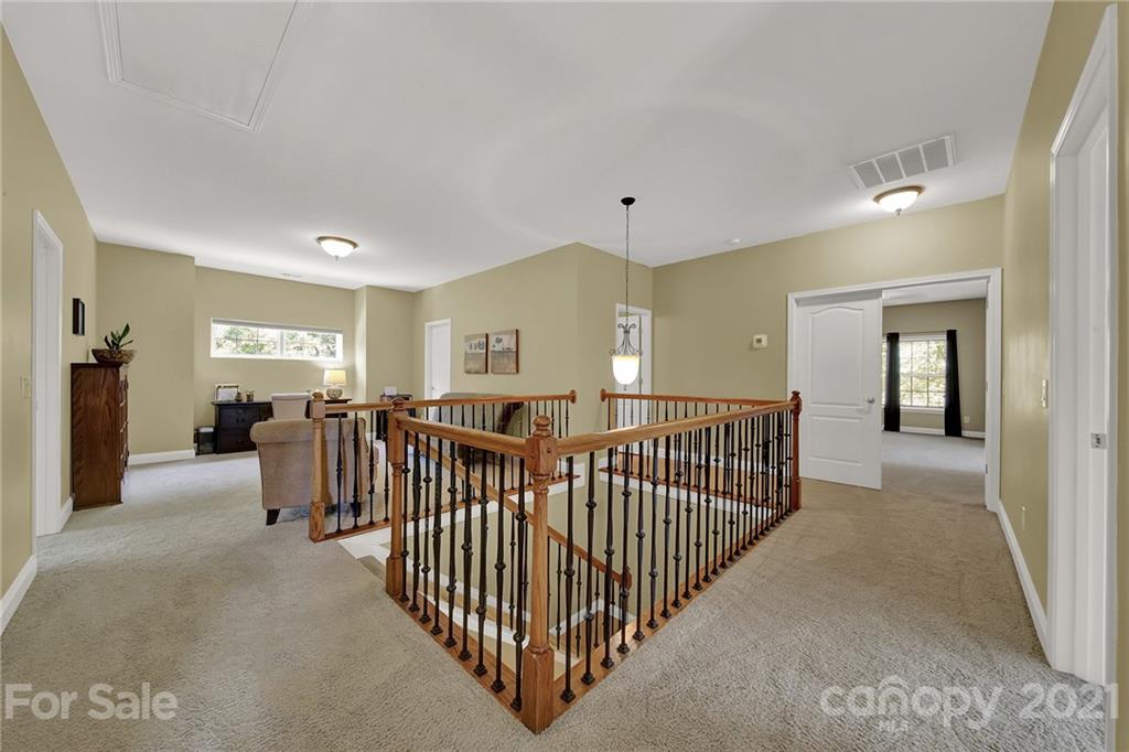 392 Windell Drive Fort Mill, SC 29708 - Photo 27 of 40 a view of livingroom with furniture windows and hardwood floor