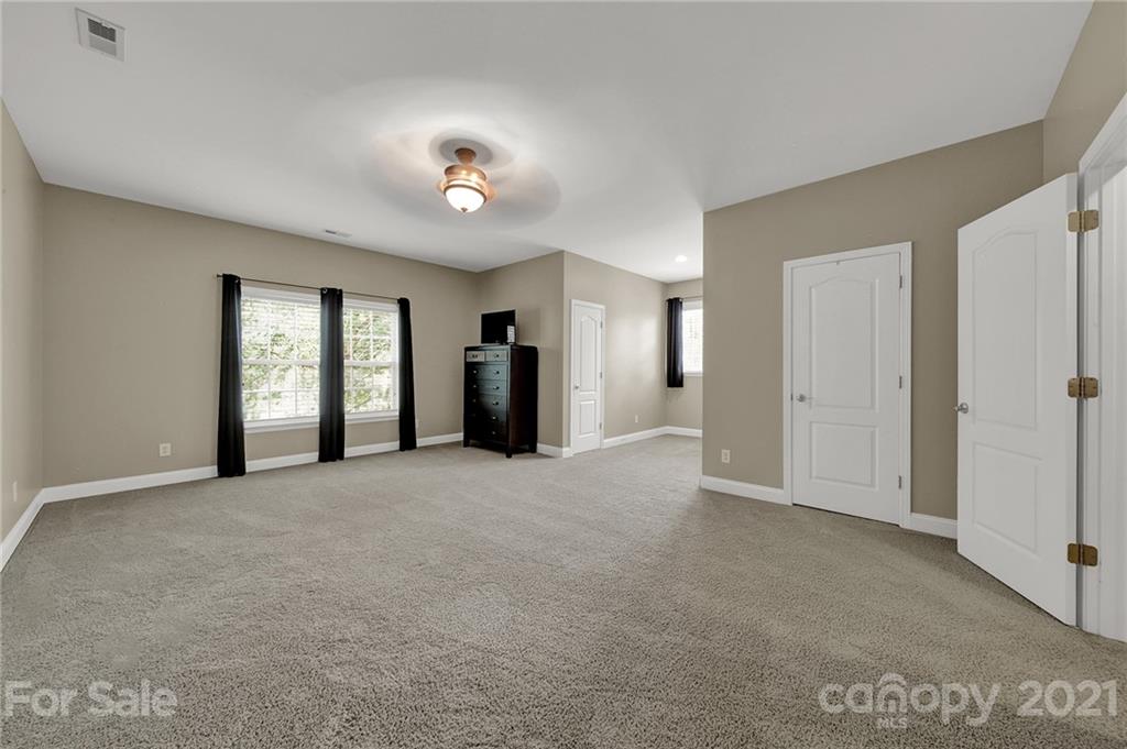 392 Windell Drive Fort Mill, SC 29708 - Photo 29 of 40 a view of an empty room with window and cabinet