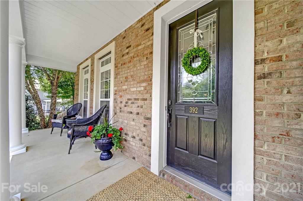 392 Windell Drive Fort Mill, SC 29708 - Photo 4 of 40 a view of a porch with chairs and potted plants