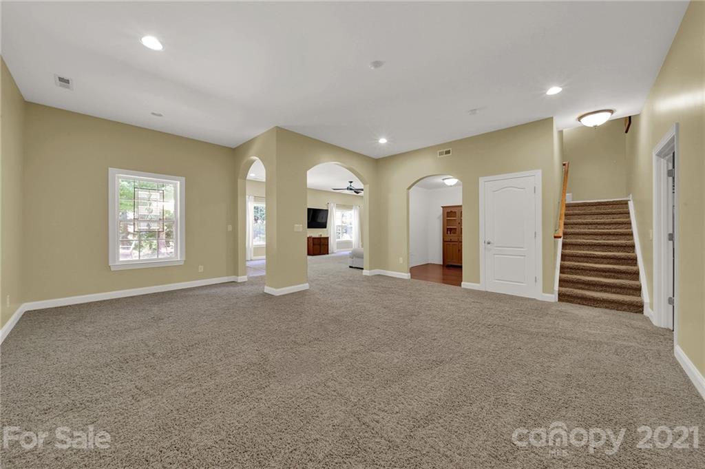 392 Windell Drive Fort Mill, SC 29708 - Photo 31 of 40 a view of a hallway with stairs and a window