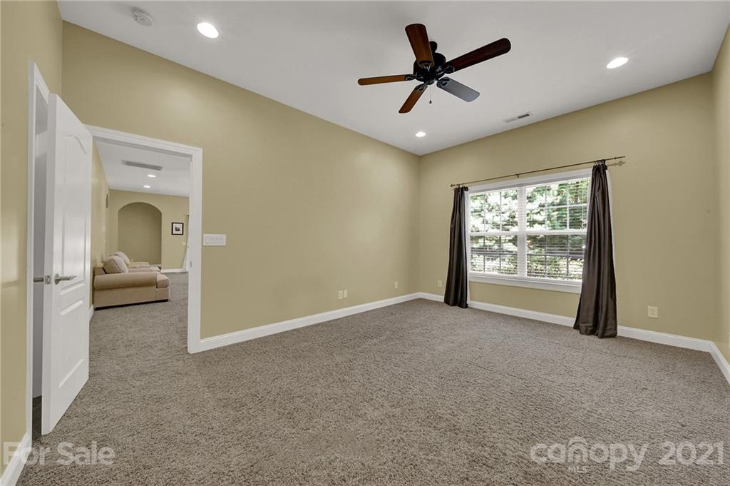 392 Windell Drive Fort Mill, SC 29708 - Photo 34 of 40 a view of a livingroom with a ceiling fan and window