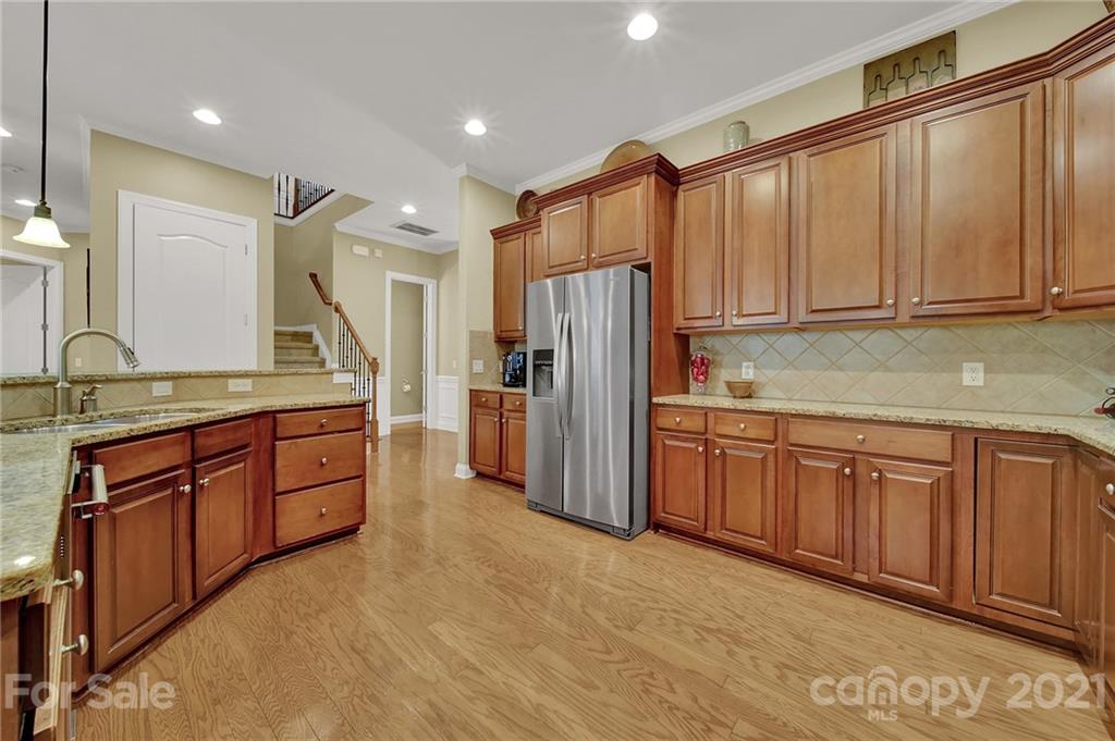 392 Windell Drive Fort Mill, SC 29708 - Photo 10 of 40 a kitchen with stainless steel appliances granite countertop a refrigerator and a sink