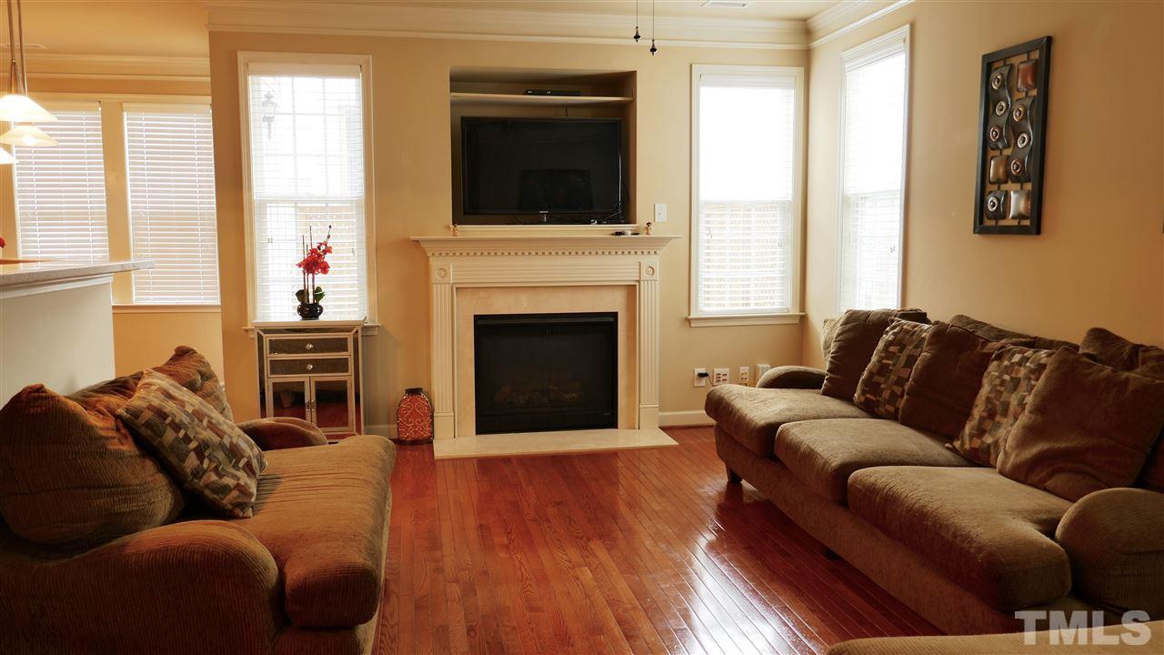 5939 Kohler Lane Raleigh, NC 27616 - Photo 4 of 8 a living room with furniture window and a fireplace