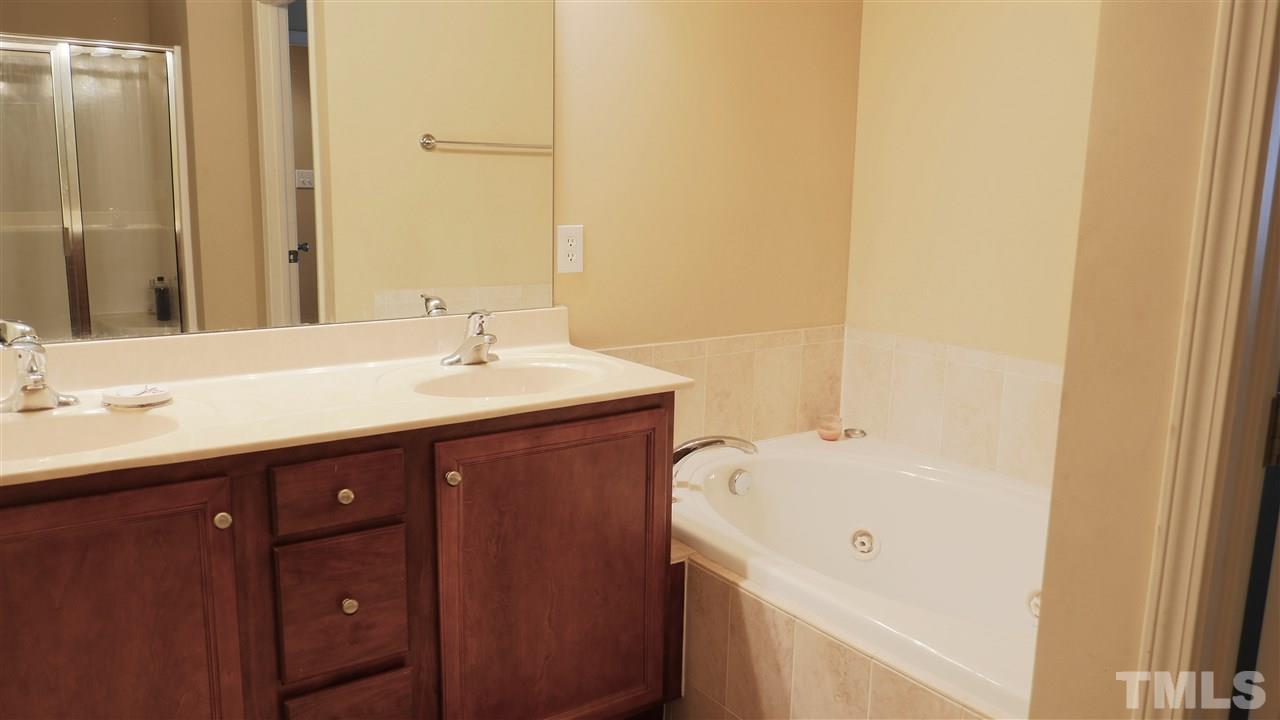 5939 Kohler Lane Raleigh, NC 27616 - Photo 7 of 8 a bathroom with a sink and a mirror