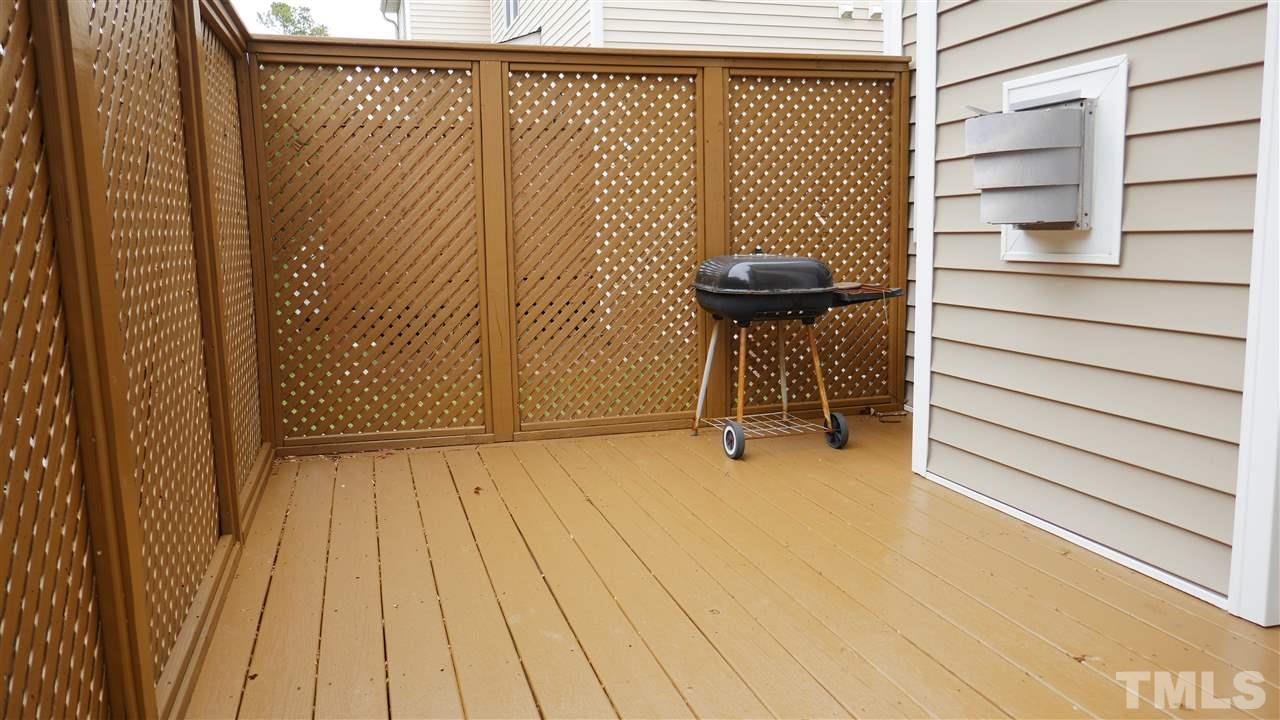 5939 Kohler Lane Raleigh, NC 27616 - Photo 8 of 8 a view of a patio with table and chairs