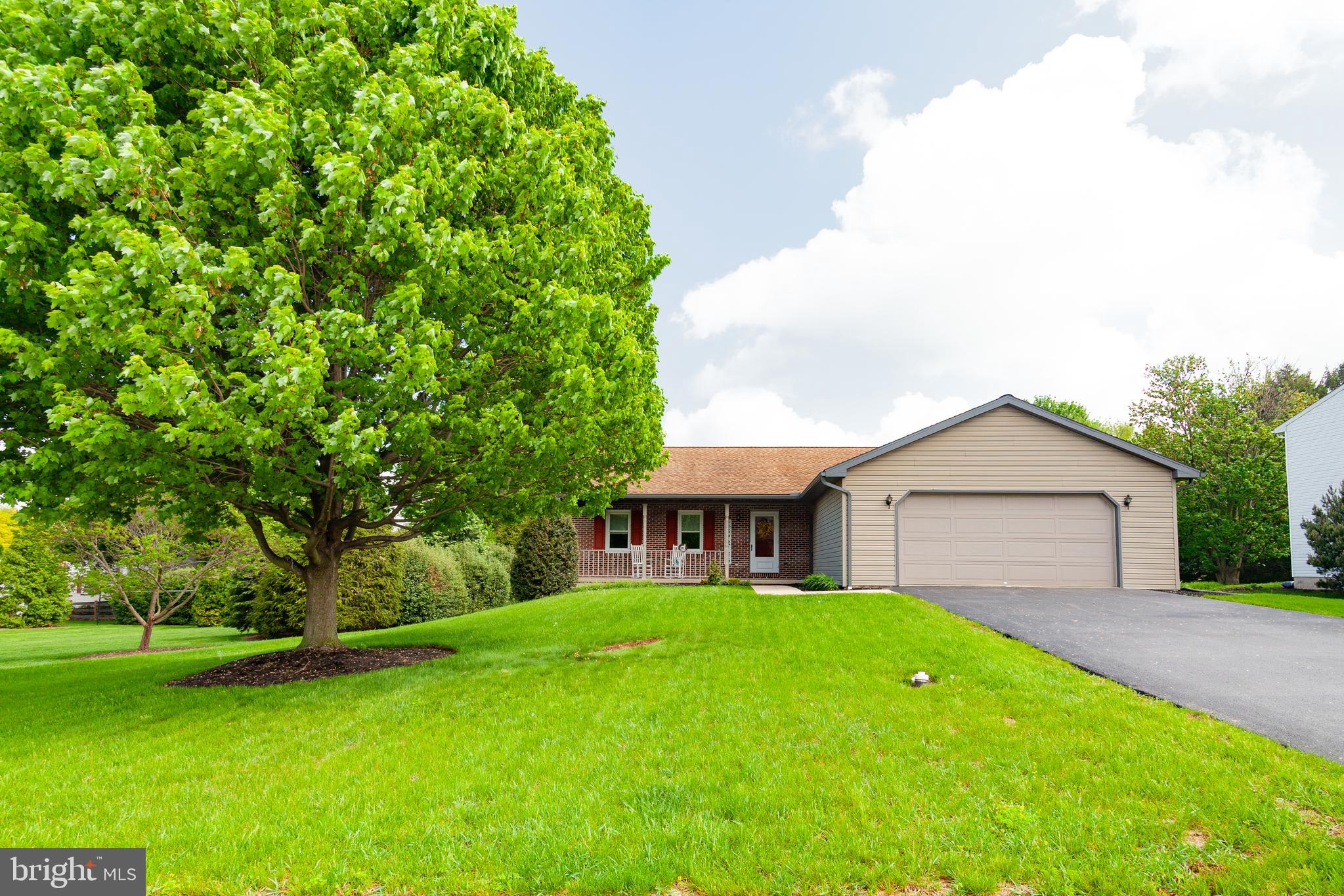 509 Weaver Road Denver, PA 17517 - Photo 1 of 48 a front view of a house with a garden