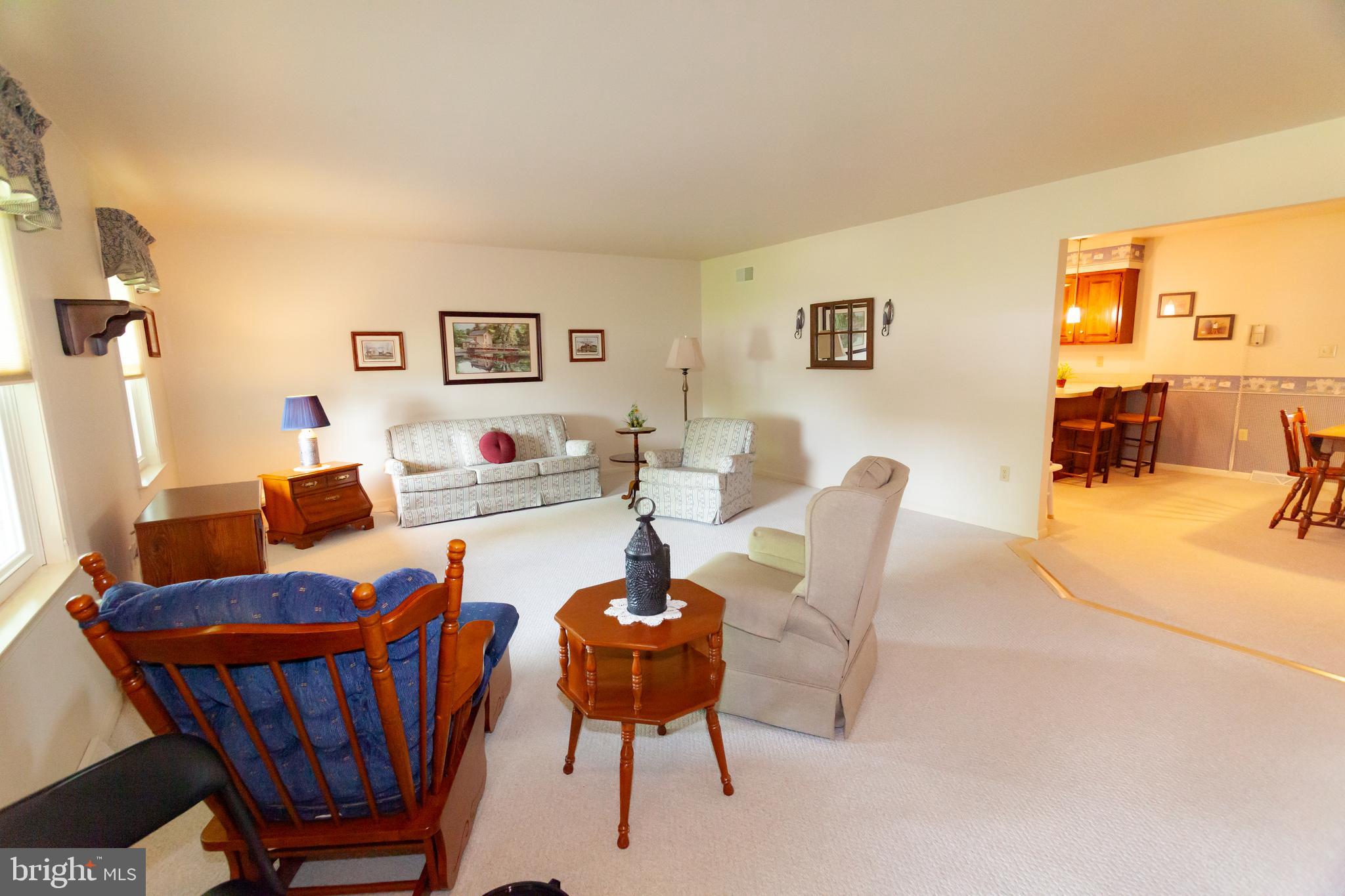 509 Weaver Road Denver, PA 17517 - Photo 8 of 48 a living room with furniture a table and a flat screen tv