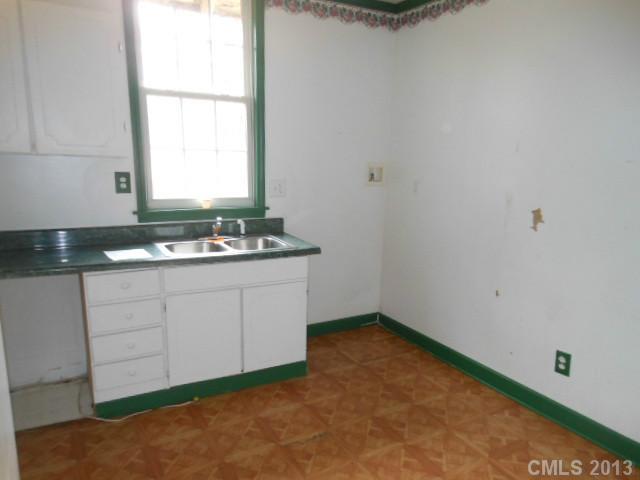 914 Ki Pope Road Belmont, NC 28012 - Photo 2 of 8 a kitchen with a sink and cabinets