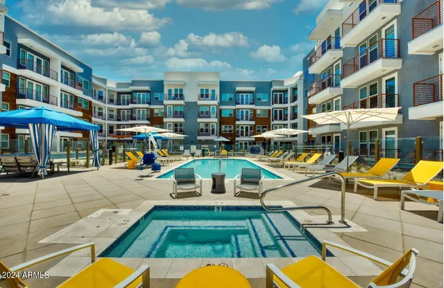 a view of a swimming pool with sitting area