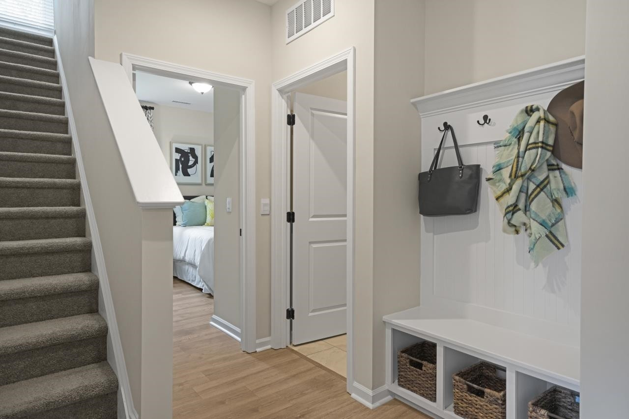 350 Madden Rose Loop Garner, NC 27529 - Photo 11 of 27 a view of a hallway view with furniture and wooden floor