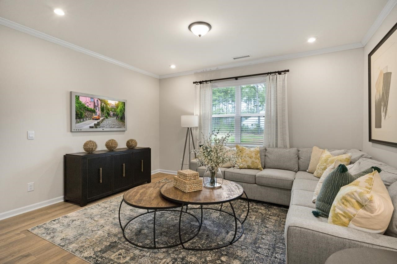 350 Madden Rose Loop Garner, NC 27529 - Photo 15 of 27 a living room with furniture and a large window