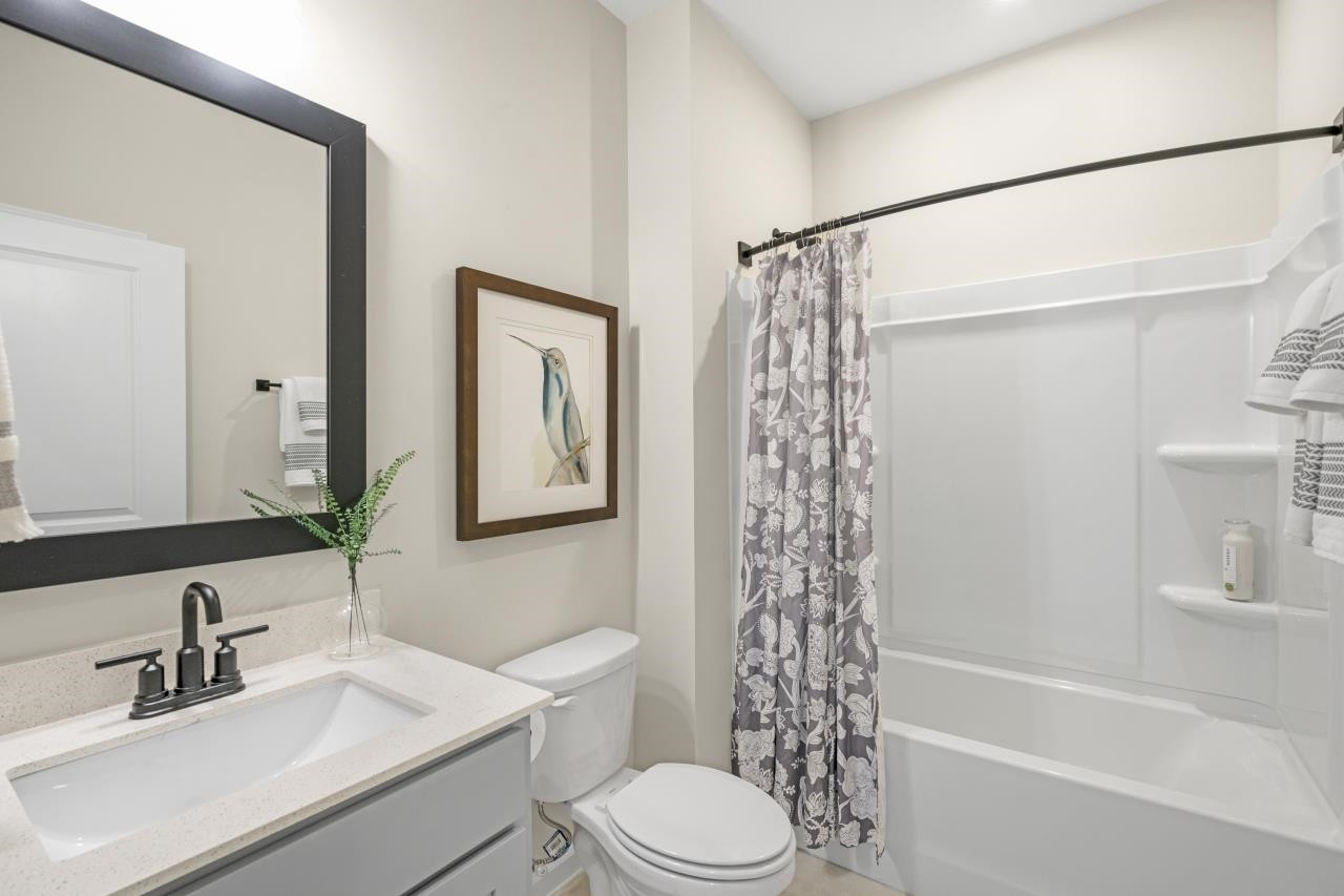 350 Madden Rose Loop Garner, NC 27529 - Photo 24 of 27 a bathroom with a sink a toilet and shower