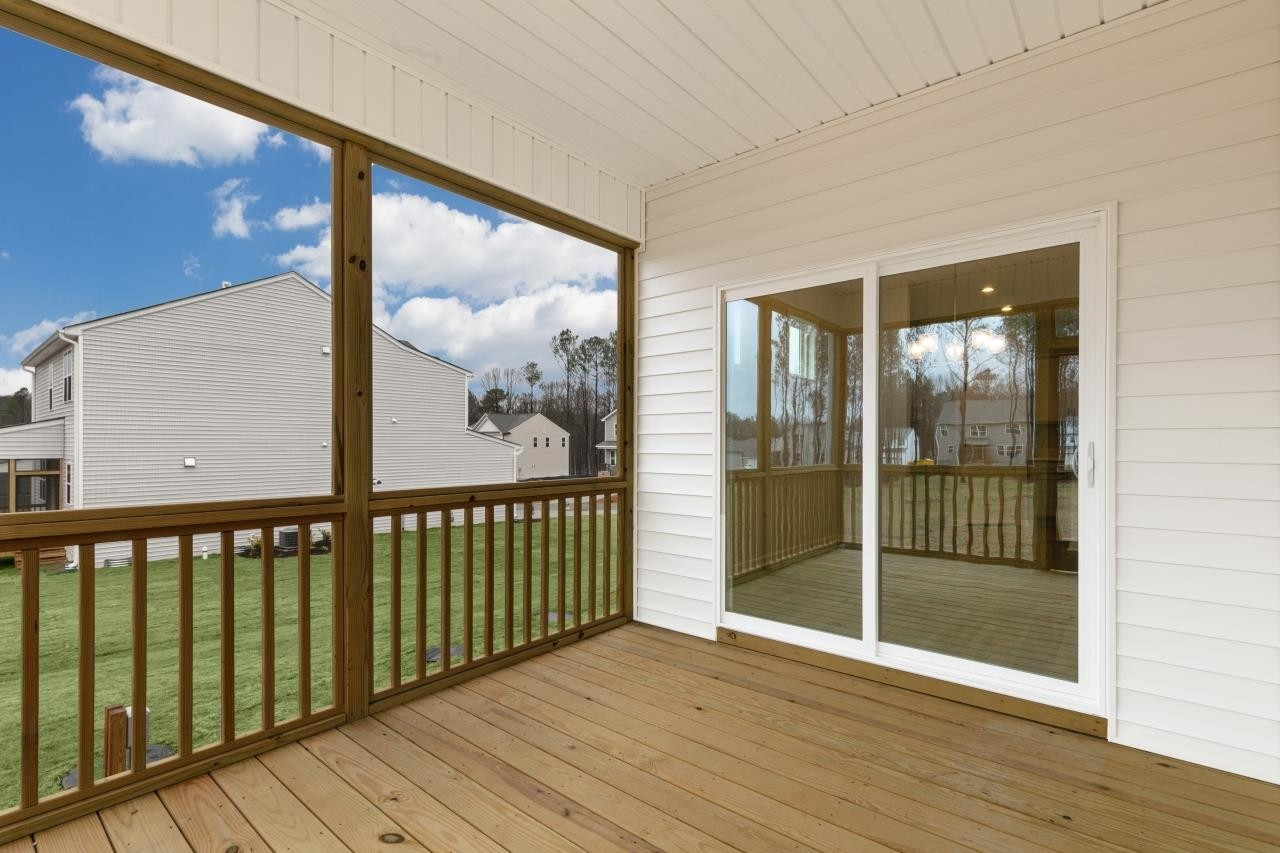 350 Madden Rose Loop Garner, NC 27529 - Photo 27 of 27 a view of a glass door with wooden floor