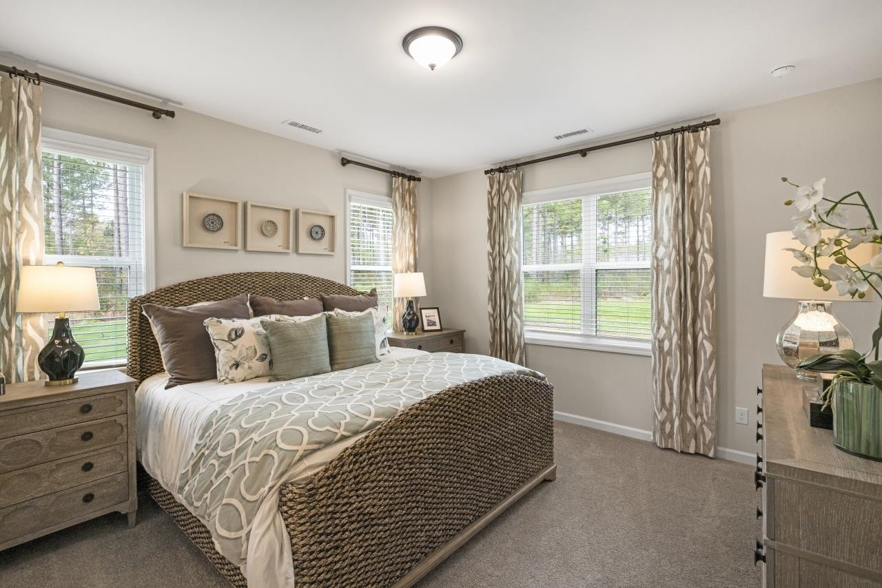 350 Madden Rose Loop Garner, NC 27529 - Photo 5 of 27 a bedroom with a bed and a window