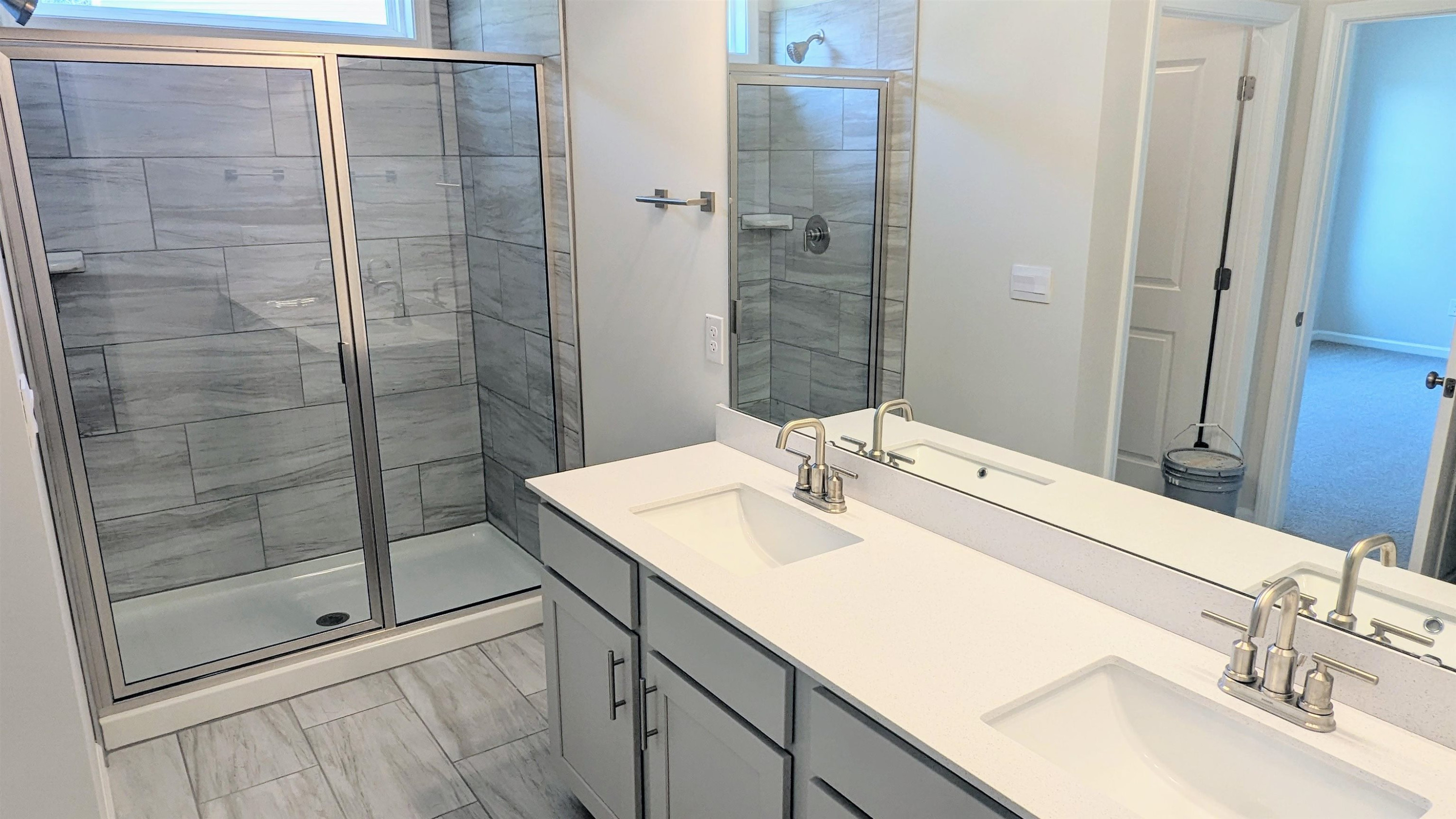 350 Madden Rose Loop Garner, NC 27529 - Photo 6 of 27 a bathroom with a sink and a mirror