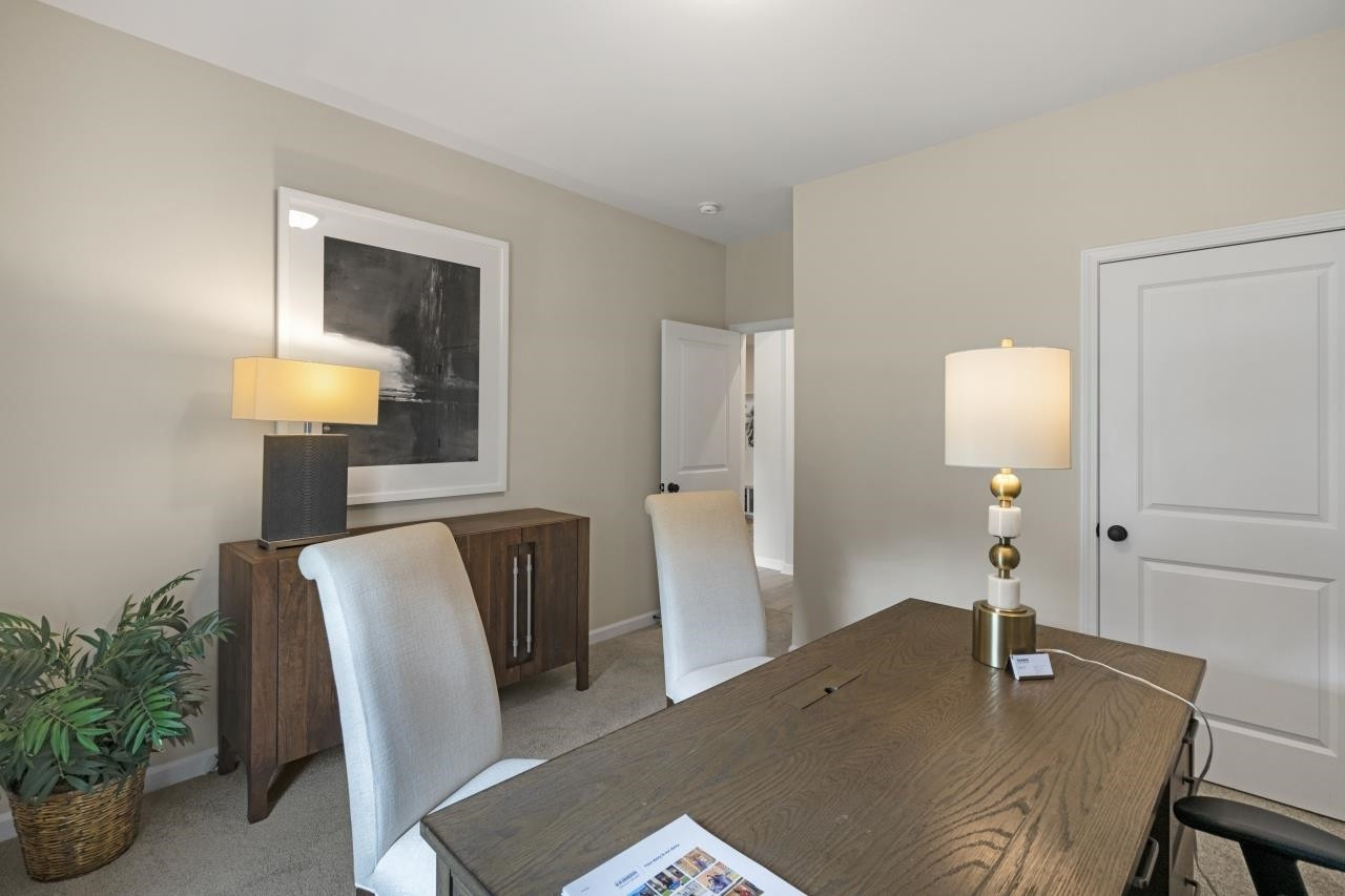 350 Madden Rose Loop Garner, NC 27529 - Photo 10 of 27 a workspace with furniture and wooden floor